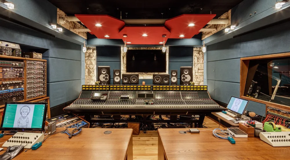 Professional mixing studio setup with monitors and acoustic treatment